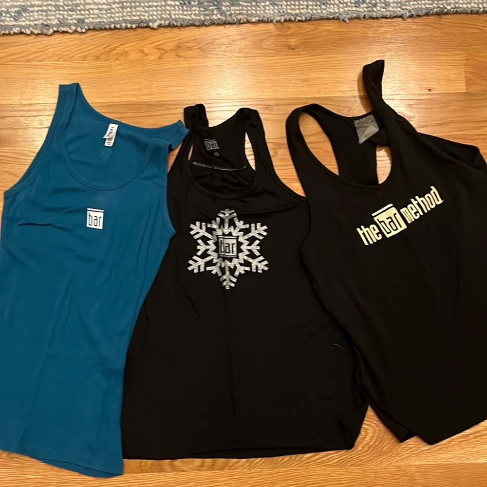 Bundle of three The Bar Method tank tops.